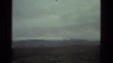 Seville Spain (1978): A Vehicle Drives Down The Road On A Winter Day Looking At