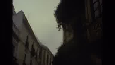 Seville Spain (1978): People Walk Down A Busy Sidewalk In A European City