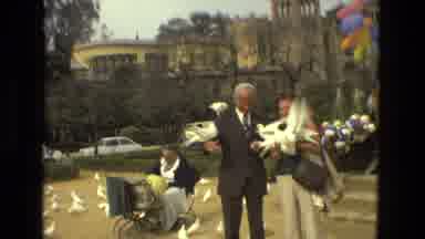 MADRID SPAIN-1978: A Couple Feeding Pigeons in a Courtyard