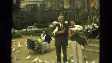 Madrid Spain (1978): Man And Woman Feed The Pigeons At The Park And Are Swarmed By