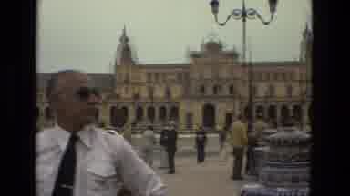 Madrid Spain (1978): Crowd Of People From Around Building As Cars Drive By