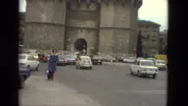 Barcelona Spain (1978): There's A Lot Of Traffic And There Are Kids Playing With