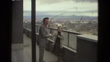 Barcelona Spain (1978): A Chandelier Flying By Then Two People Shaking Hands In A
