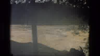 MANAUS BRAZIL-1979: Powerful Rushing River in Forested Area
