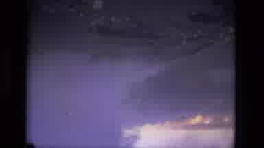 MANAUS BRAZIL-1979: Plane Captures Footage Of An Island Through The Clouds On A