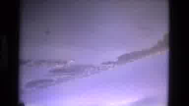 MANAUS BRAZIL-1979: Splotches And Streaks Of White Clouds Are Strung Across A