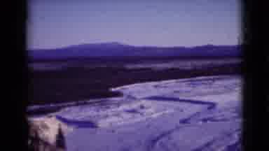 Alaska (1946): Mountains Filled With White Snow And Pine Trees Covered In Snow And