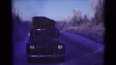 Alaska (1946): Vehicle Driving Along A Mountainside Path With A Bit Of Snow On The