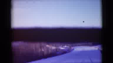 Alaska (1946): Blurry Film Showing Snow Covered Road Through Forest And Mountains