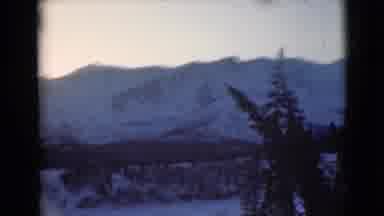 Alaska (1946): This Is A Beautiful Scene Of Snow-Capped Mountains And Trees