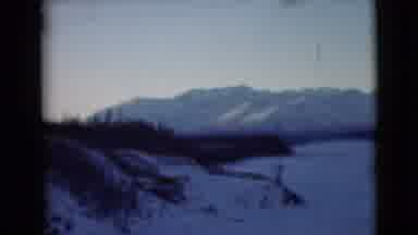 Alaska (1946): Snowy Mountains With Trees Taken From A Moving Vehicle