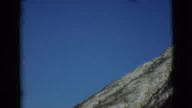 Alaska (1946): A Mountain Of Rocks And Grass And Bush Is Touching The High Sky