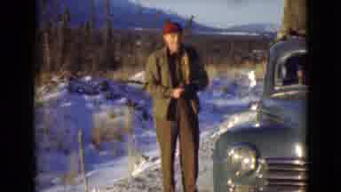 Alaska (1946): Man Standing Next To A Vintage Car