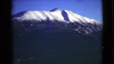 Alaska (1946): Mountain Summit From The Ground With The Peak Covered In Snow