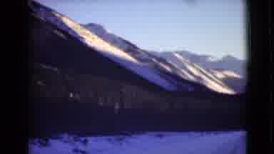 Alaska (1946): Clear Skies Behind Mountain Landscape Covered In Snow And Green