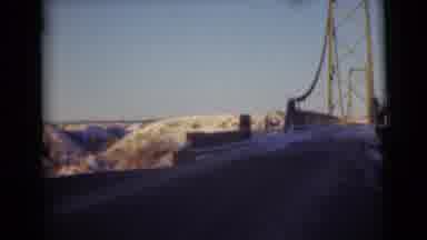 Alaska (1946): Bridge And Snow Covered Mountains On A Bright Sunny Day