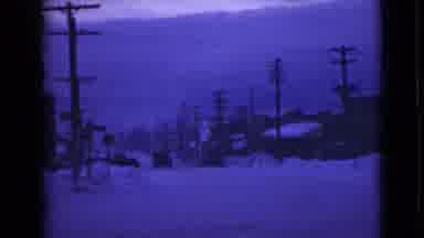 Alaska (1946): Car Travels Carefully At Low Speed On Snow-Covered Street