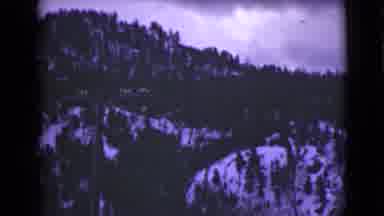 Alaska (1946): Snowy Mountains Covered With Forest And Road Through Snow