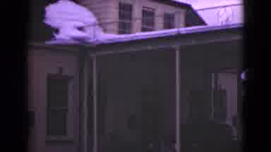 Alaska (1946): The Facade Of A Building Is Slowly Scanned Showing Many Windows A