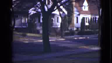 Alaska (1946): An Empty Street Lined By Trees Runs Next To Houses