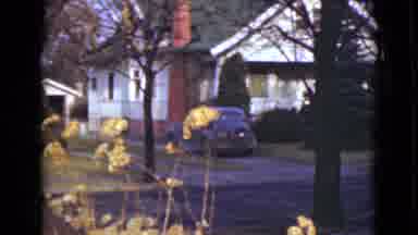 Alaska (1946): Two Houses In A Residential Area And One Has A Car Parked In Front