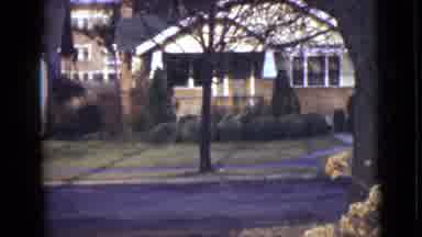 Alaska (1946): An Empty Street In Front Of Trees And Houses Close Together