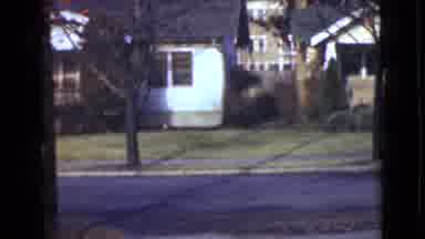 Alaska (1946): A Man And A Woman Standing On The Road And Watching Houses Across