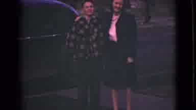 Alaska (1946): Mother And Son In Front Of A Car