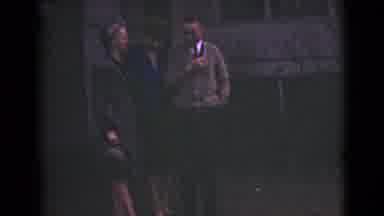 Alaska (1946): Two Groups Of Young Adults Standing Outside Up Against A Wall