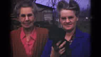 Alaska (1946): Two People Riding Horses And Two Women Holding A Small Black Dog