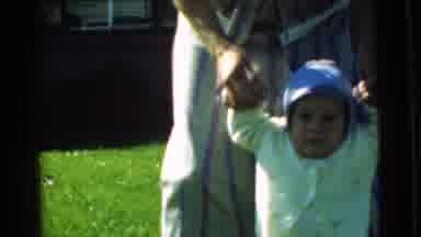 Chatham New Jersey (1951): Woman Helping Child Walk On Grass On A Sunny Day