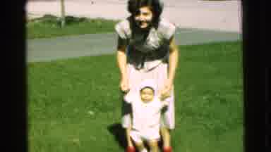 Chatham New Jersey (1951): Woman Plays With A Newborn Child Outside Her Home On A