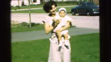 Chatham New Jersey (1951): Mother Picking Up Child From Grass And Playing With Its