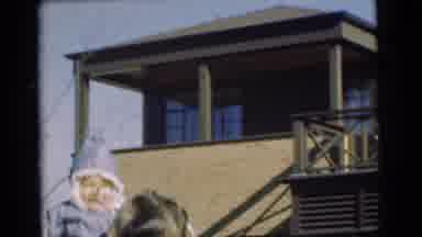 Chatham New Jersey (1951): A Man Standing In Front Of A House Throwing A Baby In