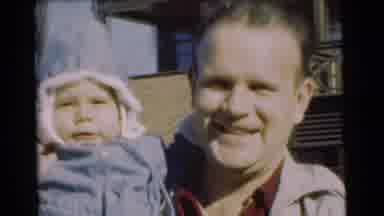 Chatham New Jersey (1951): A Man Kissing A Young Child Who Is Wearing A Snowsuit