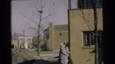Chatham New Jersey (1951): A Woman And A Baby Walking Outside