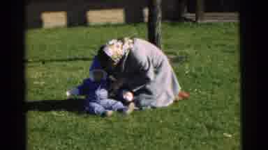 Chatham New Jersey (1951): A Lady And A Baby Sitting On A Big Lawn On A Sunny Day