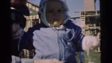 Chatham New Jersey (1951): Adult Trying To Cheer Up A Crying Baby Bundled Up In A