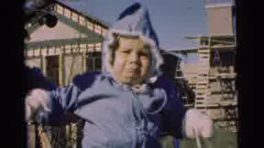 Chatham New Jersey (1951): Unhappy Small Child Bundled Up In A Blue Snow Suit Hand
