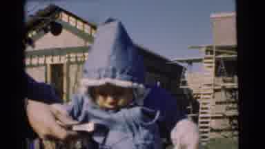 Chatham New Jersey (1951): Baby In Winter Clothes Being Entertained With A Device