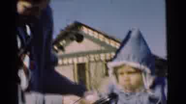 Chatham New Jersey (1951): Woman Wearing Grey Coat Holds Black Object In Front Of