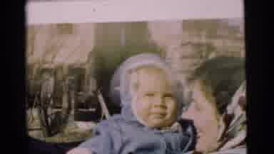 Chatham New Jersey (1951): A Woman Holding A Baby With A Blue Jacket And Hood
