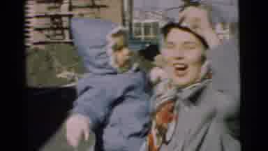 Chatham New Jersey (1951): Woman Wearing Grey Coat Holds Baby Wearing Blue Coat On
