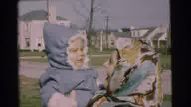 Chatham New Jersey (1951): Woman With The Scarf Playing With Child In Her Arms On