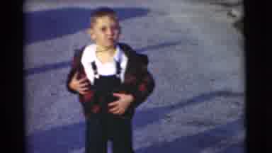Chatham New Jersey (1951): Cute Child In Jeans Outfit Taking Off His Plaid Coat