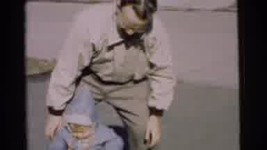Chatham New Jersey (1951): A Small Boy Is Playing In The Road With Their Parents