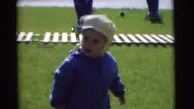 Chatham New Jersey (1951): Toddler In Blue Jacket And White Hat Waddles Around The
