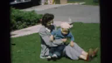 Chatham New Jersey (1951): A Woman Playing Outside With Toddler While Sitting On