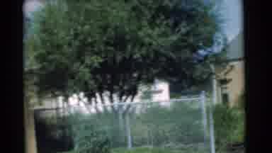 Chatham New Jersey (1951): A Black Car Parked In Tan Garage On A Sunny Day