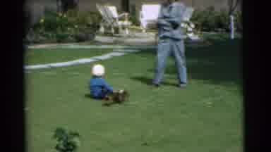 Chatham New Jersey (1951): A Woman Sits A Little Boy Down On A Lawn In Front Of A